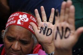 Supporters of Zelaya raise their painted hands calling the people not to vote in the November 29 "election", during a demonstration in Tegucigalpa.